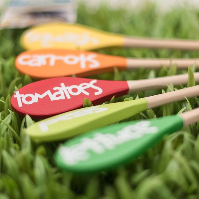 wooden spoon plant markers in grass