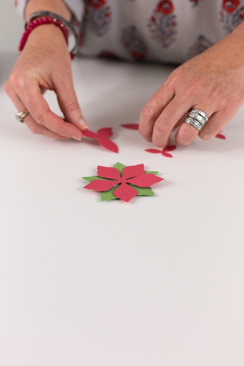 remove pieces from mat and assemble poinsettia