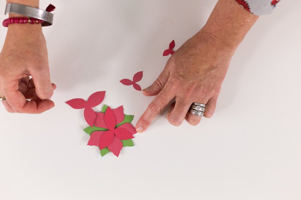 remove pieces from mat and assemble poinsettia