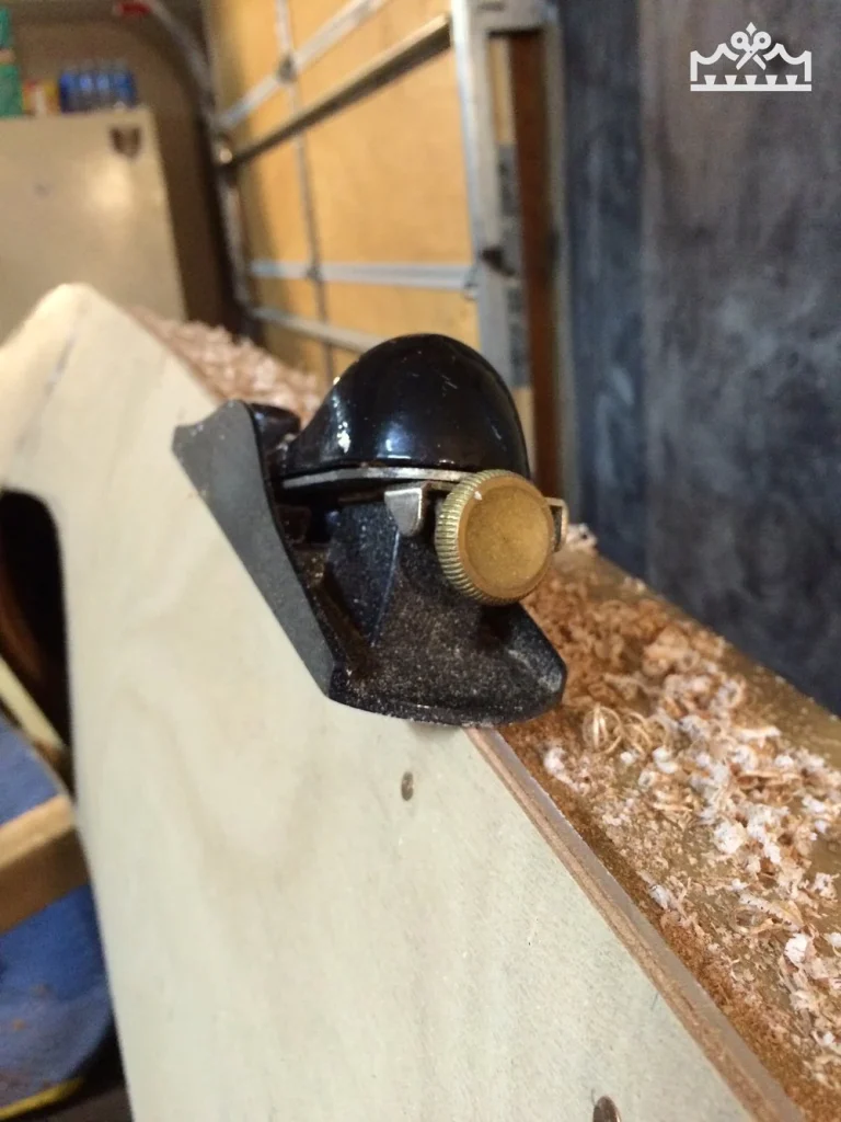smoothing wooden kayak
