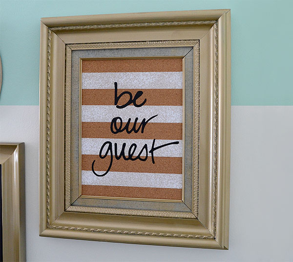 be our guest Cricut wall art hanging on the wall 
