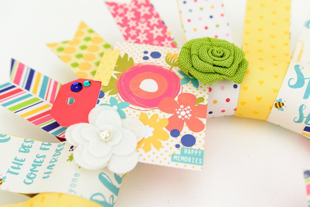 bright paper wreath with fabric flowers