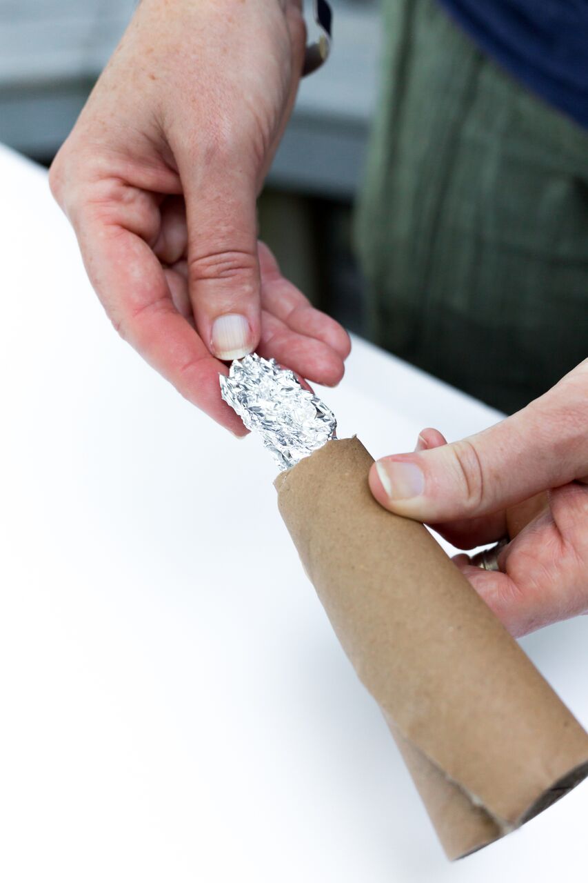 use a small piece of aluminum foil to create a “tail” and insert it in to the skinny end of the tube