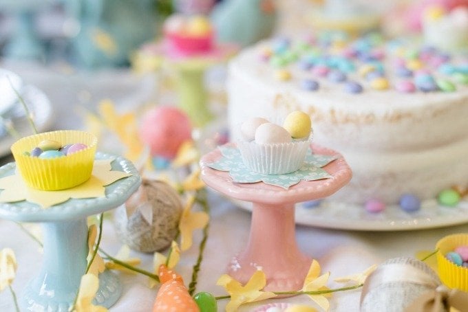 candy and white cake on bright spring Easter table