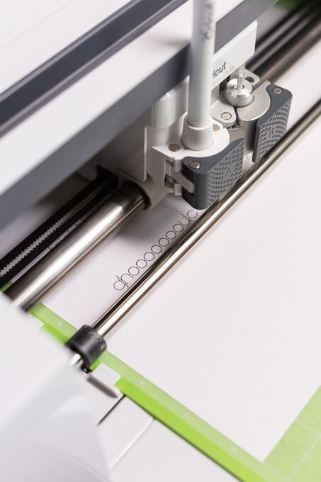 place your Cricut pen into your machine and close the clamp