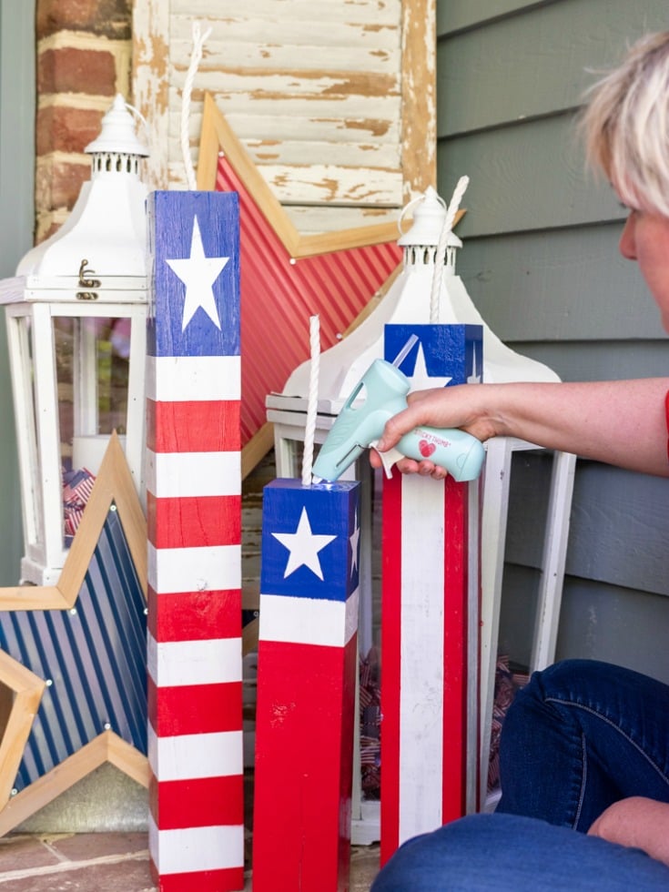 hot glue wick into firecracker base for patriotic decorations