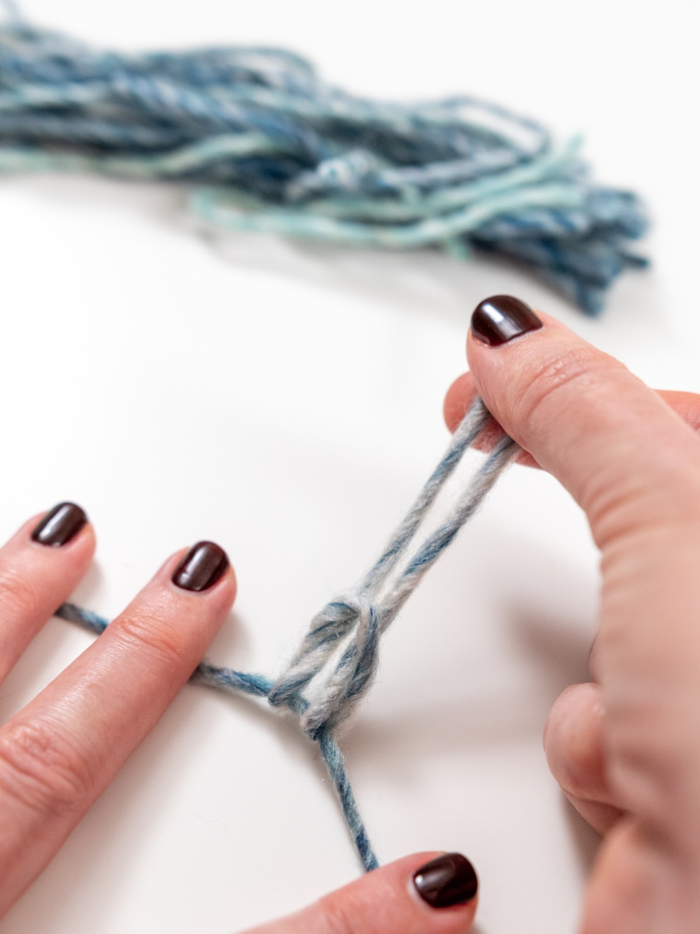 pull yarn ends through loop