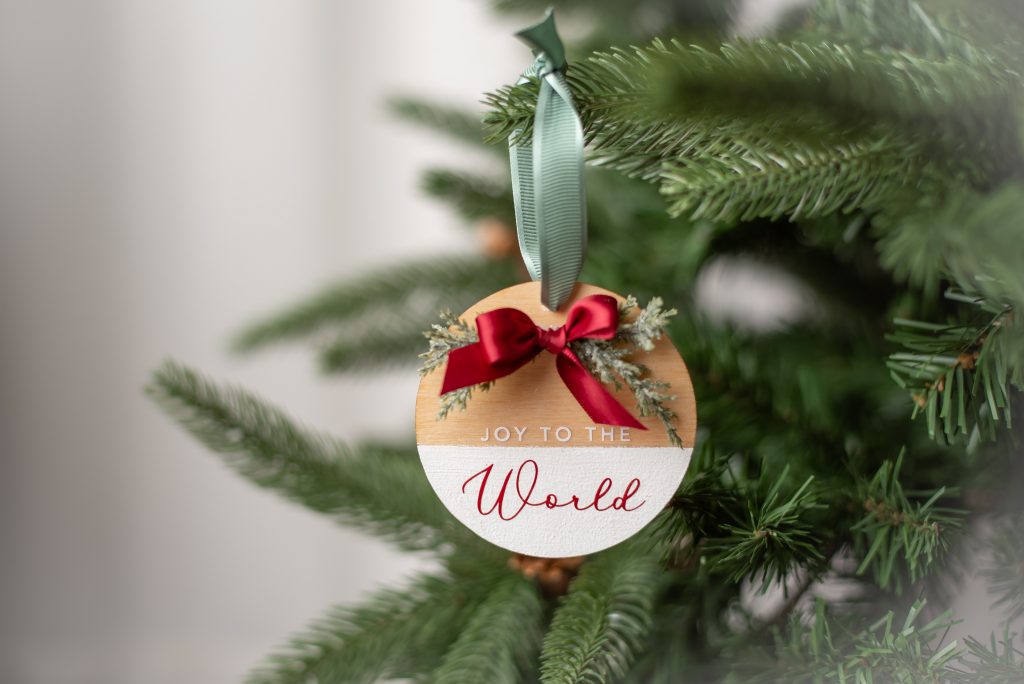 cricut wood ornament hanging on tree
