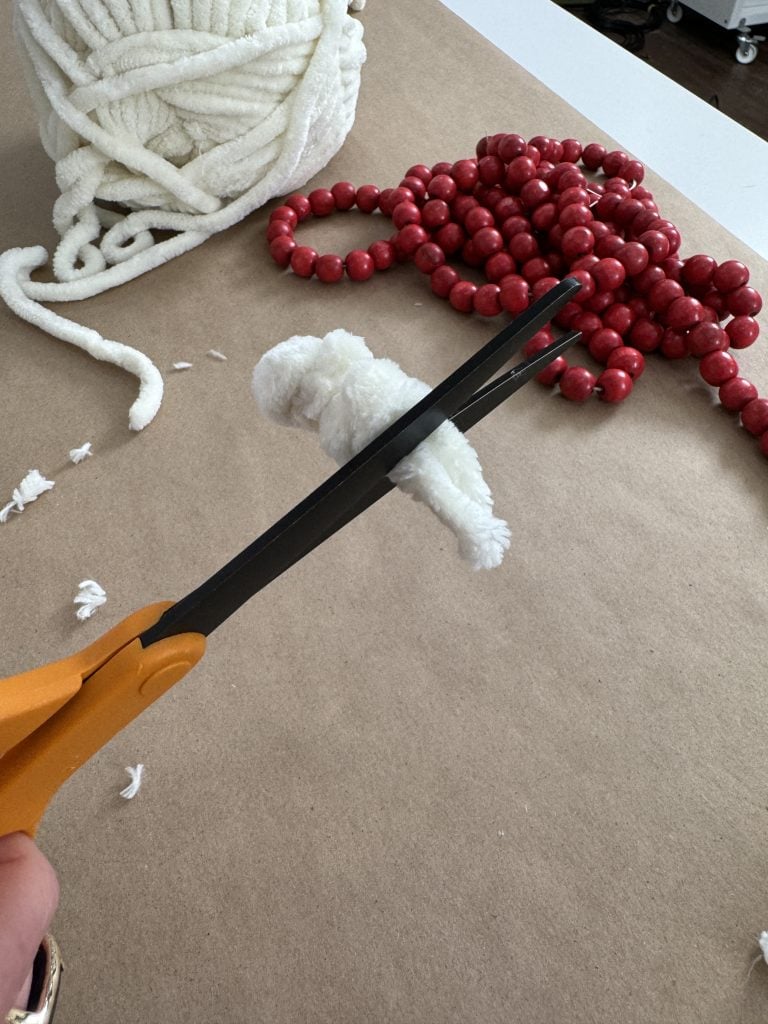 woman cutting chenille yarn