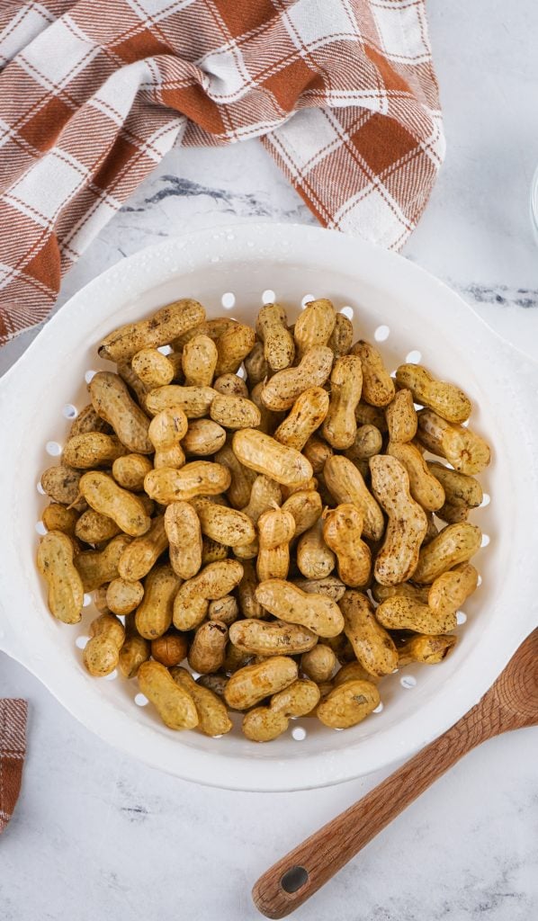 raw shelled peanuts in colander