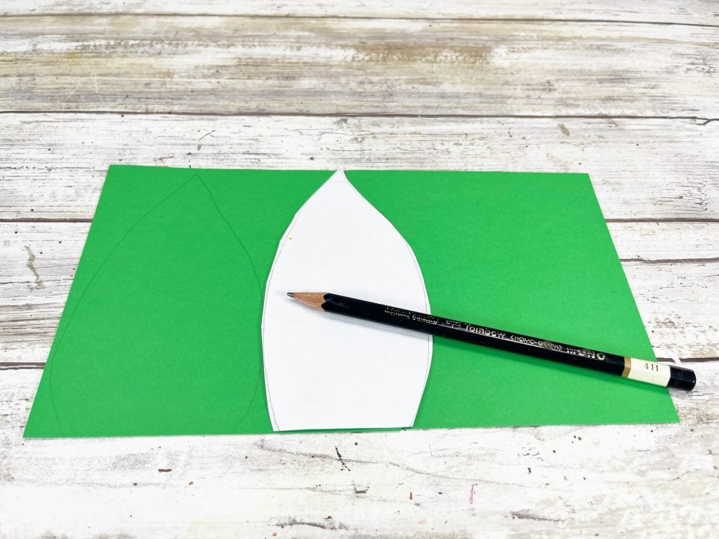 trace leaf onto green paper